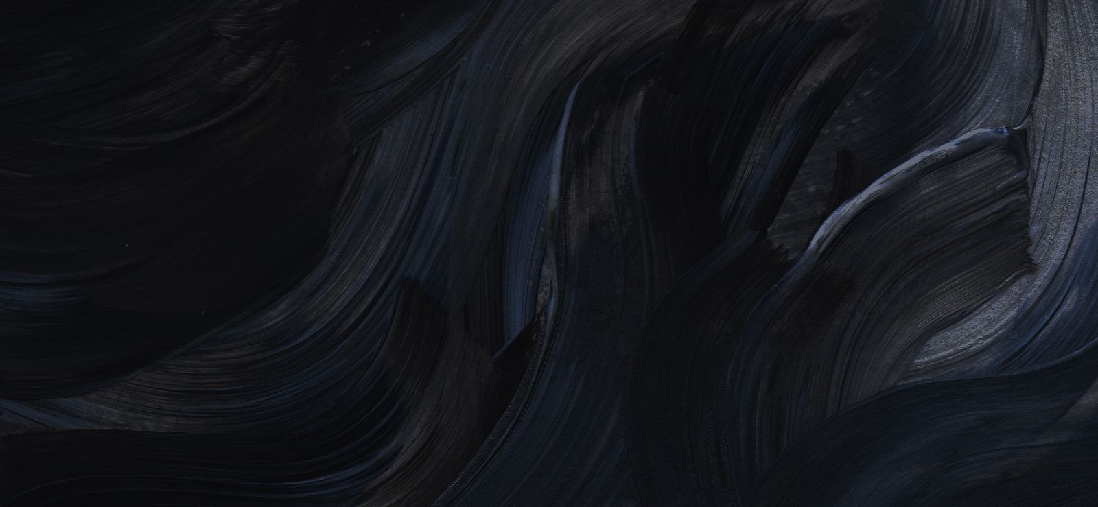 Abstract dark blue and black paint texture.