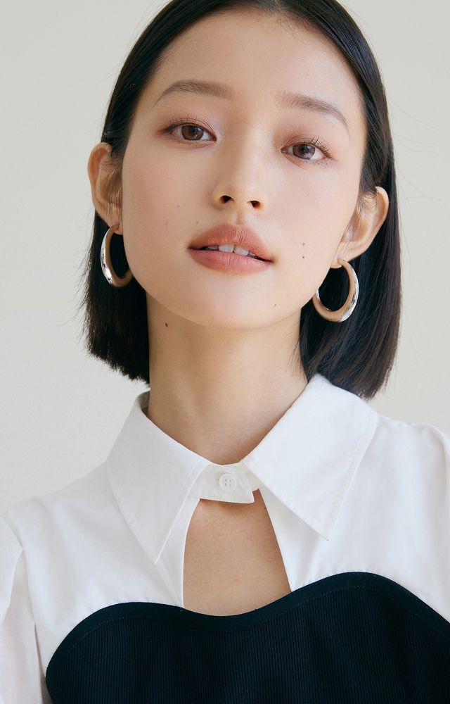 Portrait of a woman with long hair.
