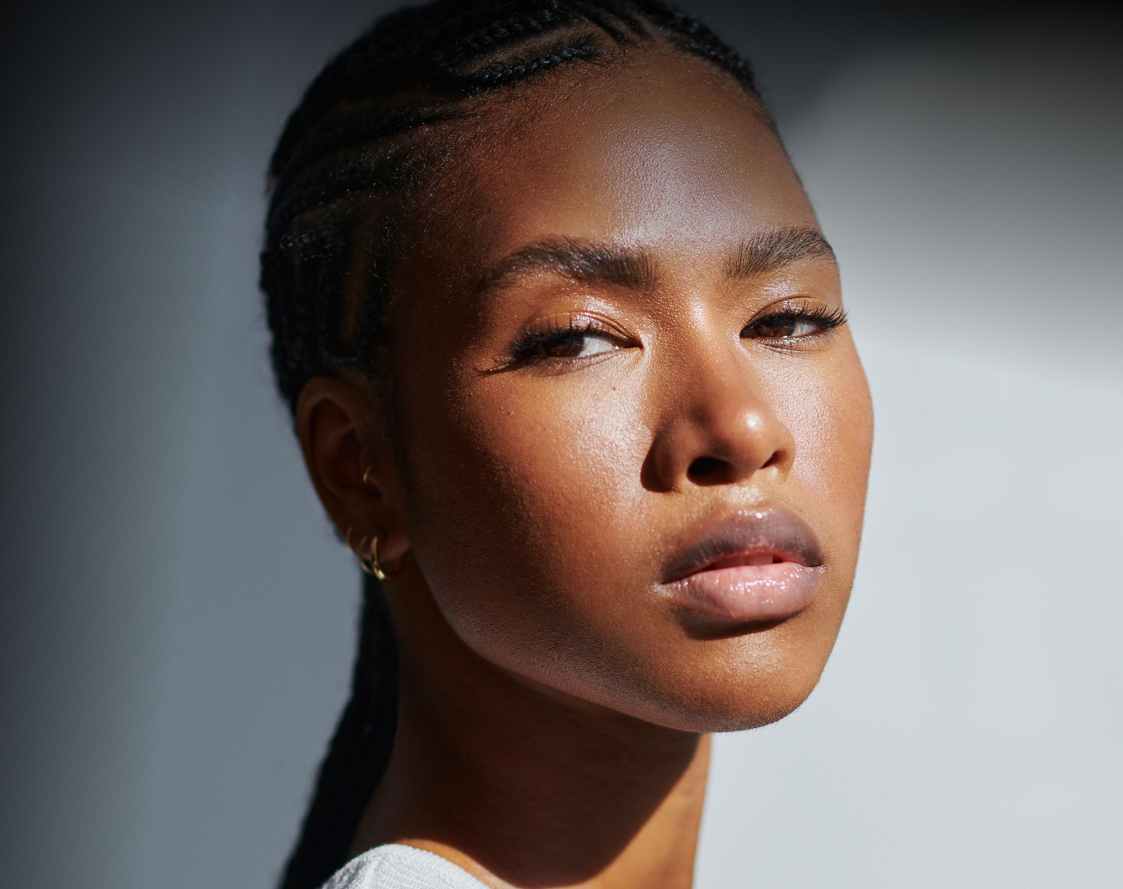 Smiling man in a stylish jacket and shirt.